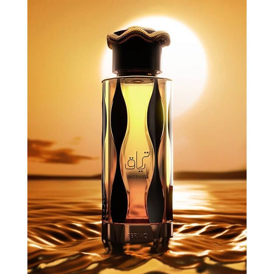 Lattafa Teriaq Intense Perfume Spray, 100 mL (3.4 fl oz) bottle with artistic design against a sunset background